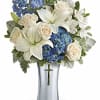 This majestic bouquet includes blue hydrangea, white asiatic lilies, white alstroemeria, light