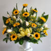 BASKET FOR SYMPATHY. DESIGNED WITH SUNFLOWERS AND WHITE ROSES