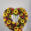 OPEN HEART DESIGNED WITH SUNFLOWERS AND RED ROSES NICELY DECORATED WITH OTHER