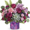 Inspired by stained glass, this magnificent mosaic glass vase, filled with fabulous