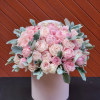 This breathtaking flower arrangement features pink peonies elegantly displayed in hatboxes.