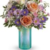 This floral arrangement features the sweetest shades of spring in one whimsical