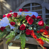 This Casket spray features red roses, red gladiolas, fern leaf, &amp; Eucalyptus.
