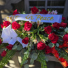 This Casket spray features red roses, red gladiolas, fern leaf, &amp; Eucalyptus.