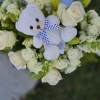 The &quot;Compassionate Rememberance&quot; is a tall all white sympathy arrangement. Featuring All