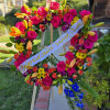 a warm &amp; bright funeral spray, with orange lily, hot pink rose