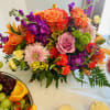 A great gift for any occasion, this basket of bright, fragrant flowers