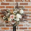 An airy blend of seasonal blooms in your wedding color palette. Featuring