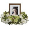 Keep fond memories close to your heart with a floral wreath of