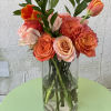 This arrangement is a beautiful combination of garden roses,tulips, and roses in