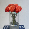 13 long stem Orange roses with an smooth, elegant tangerine center arranged
