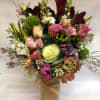 A beautiful palate of colors and wild, natural flowers including kale, spray