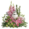 Honor the cremation urn with this pristine pink arrangement of hydrangea, roses