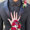 A classic red rose and baby&#039;s breath corsage compliments any outfit. Perfect