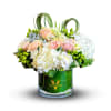 This serene bouquet features white hydrangeas, cream roses, and greens, creating a
