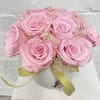 12 light pink preserved roses in an elegant ceramic vase. These natural