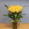 Yellow roses with spiral  eucalyptus and lemon leaves, glass clear vase
Regular