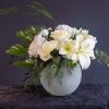 This elegant sympathy arrangement embodies enduring beauty and peaceful serenity in a