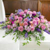 A beautiful array of lavender and purple flowers designed to rest of