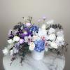 Inspired by the beauty of amethyst crystals, this bouquet of purple, lavender