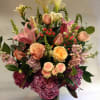 This tall arrangement comes complete with white calla lilies, pink lilies, blush