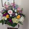 assorted flowers in wooden box