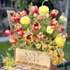Bright and Elegant combination of Tulips, Ranunculus, and Iris flowers are put
