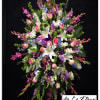 This towering sympathy standing spray is filled with roses, stock, gladiolas, larkspur