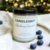A handcrafted scented soy blend candle at our store. The candle is
