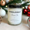 A handcrafted scented soy blend candle at our store. The candle is