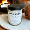 A handcrafted scented soy blend candle at our store. The candle is