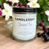 A handcrafted scented soy blend candle at our store. The candle is