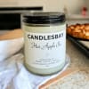 A handcrafted scented soy blend candle at our store. The candle is