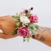 Handmade Wrist Corsage typically using spray roses or assorted small blooms.
Customizable upon