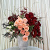 This captivating arrangement showcases a stunning harmony of color and texture. Rich