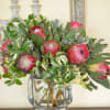 Stunning proteas in glass vase 