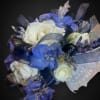A rose mixed with additional accent flowers to create a truly beautiful