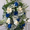 Introducing &quot;Serene Blue Reflections Spray,&quot; a tranquil floral arrangement designed for funeral