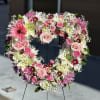 Introducing the &quot;Blushing Rose Heart Tribute,&quot; a delicate floral arrangement shaped in