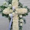 it is made with:
30 white mums
12 white roses
2 baby breath
greens 
eucalyptus
white bow
