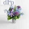 Denver Flower pros presents this arrangement in blues and purples. It gives