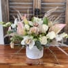 Rustic cement container with soft bouquet in whites and pinks.