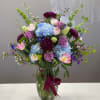 The beaut is dripping in jewel toned blooms ready to bring a