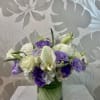 A purple and white arrangement designed with love 