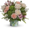Straight out of a storybook, this whimsical bouquet of creamy blooms is