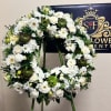 Beautiful all white wreath in remembrance of your loved one.