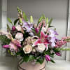 A grand arrangement filled with beautiful yet elegant flowers! A grand gift