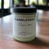 A handcrafted scented soy blend candle at our store. The candle is