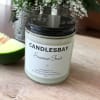 A handcrafted scented soy blend candle at our store. The candle is