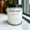 A handcrafted scented soy blend candle at our store. The candle is